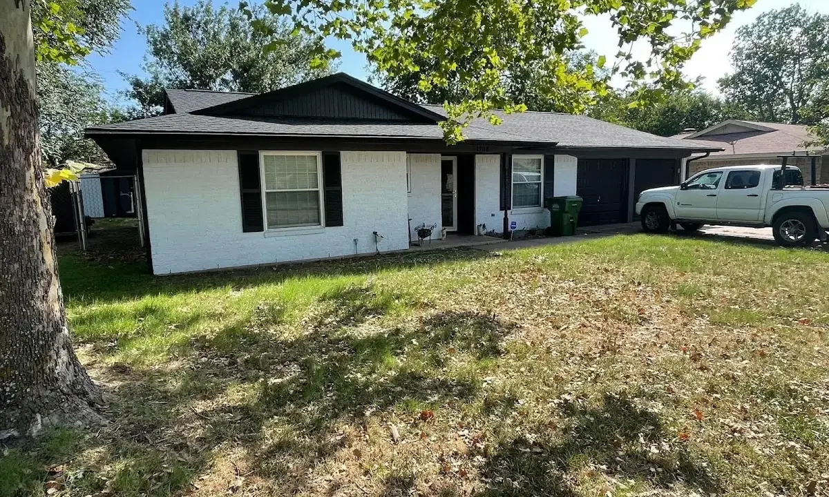Professional roofing crew working on a residential roof in Kaysville